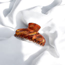 Pince Jeanne Simone modèle iconique capo acétate coloris rouille et doré.